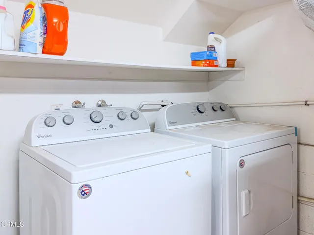 an empty room with furniture and a window