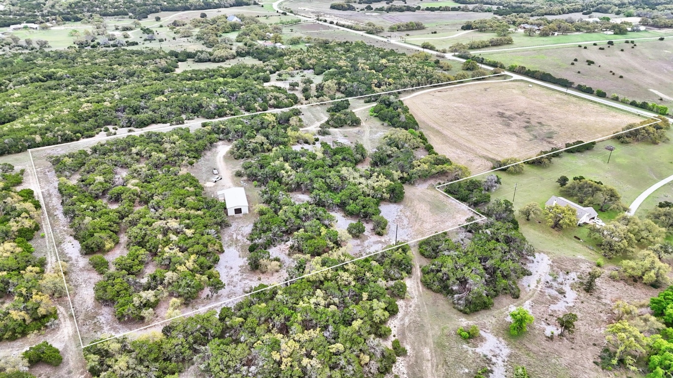 10750 Darden Hill Road Austin, TX 78737 - Photo 3 of 16 an aerial view of residential houses with outdoor space