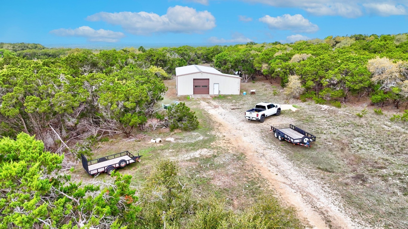 10750 Darden Hill Road Austin, TX 78737 - Photo 6 of 16 a view of a backyard with a patio