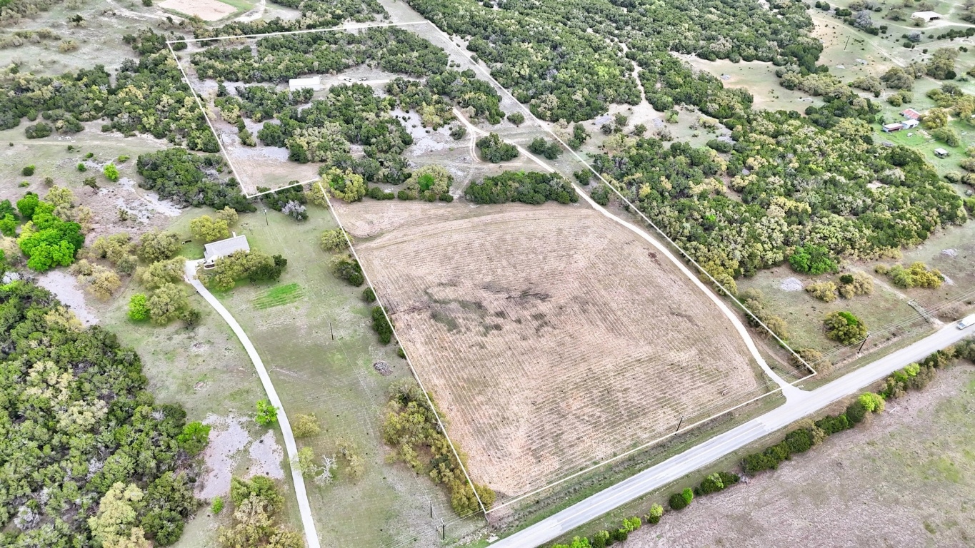 10750 Darden Hill Road Austin, TX 78737 - Photo 10 of 16 a view of a yard with a wooden floor