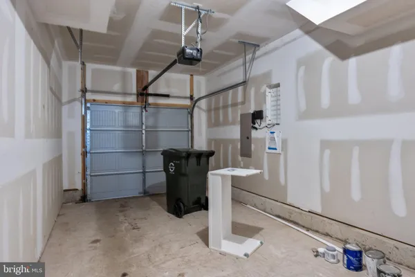 a view of a backyard with parking space