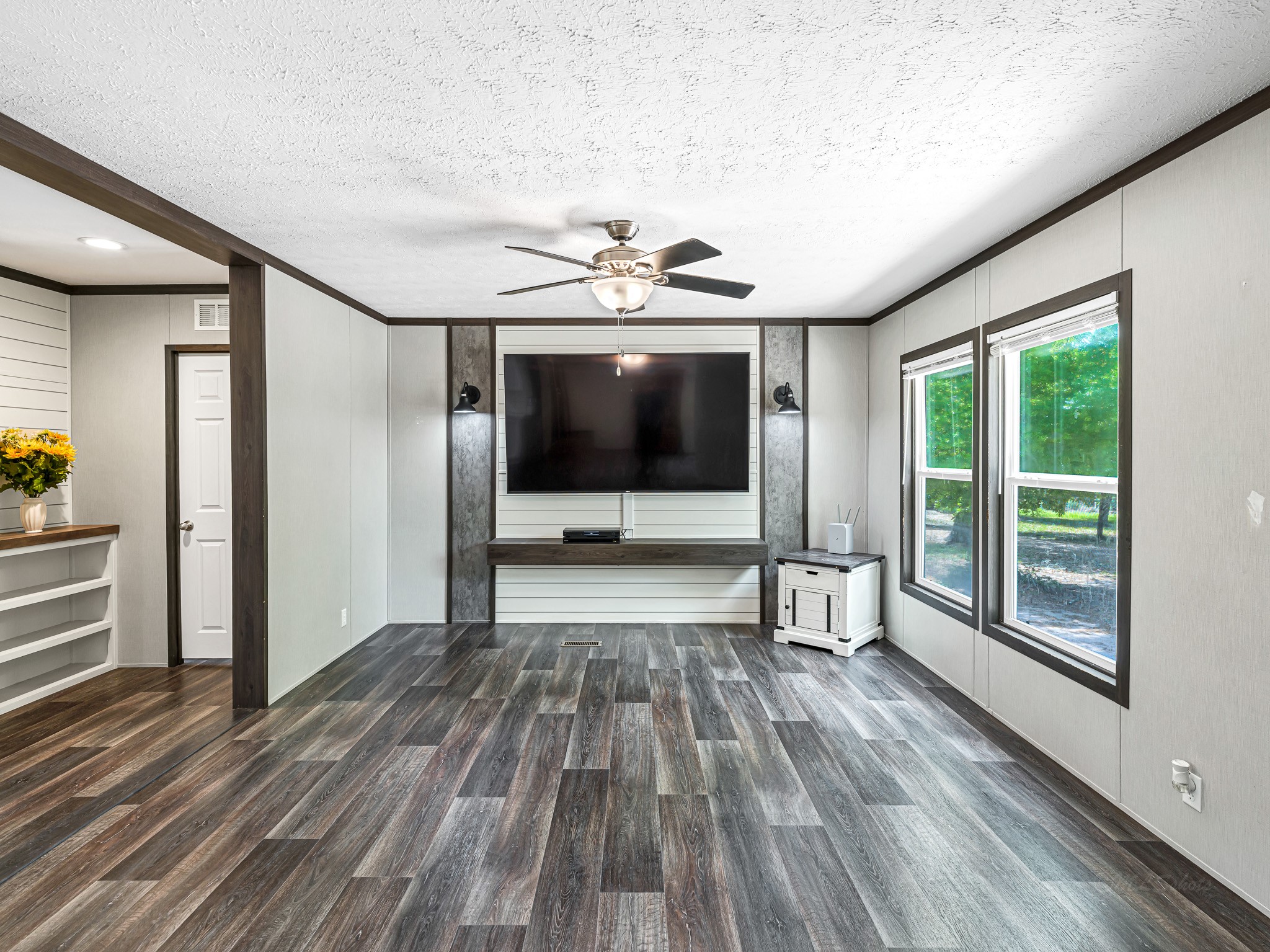 1047 Jimbob Lane New Ulm, TX 78950 - Photo 2 of 18 85" TV and 4k DVD player STAYS!!! Beautiful flooring and full of natural light, this living room is ready for you to get settled in!