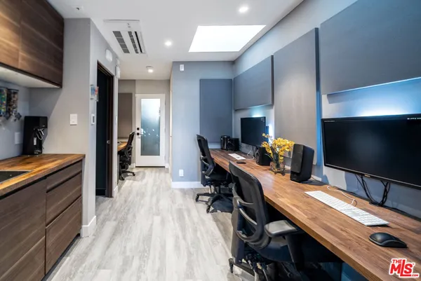 a view of a workspace with furniture
