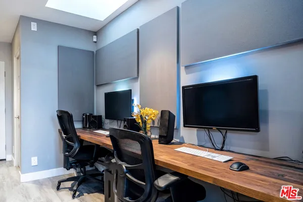 a view of a workspace with furniture
