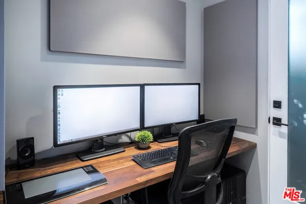 a view of a workspace with furniture