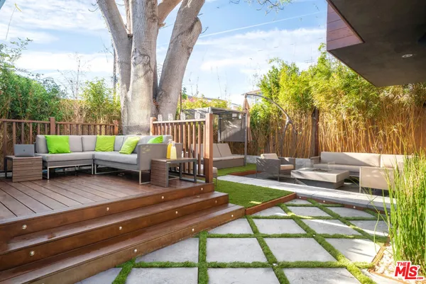 a view of a patio with swimming pool table and chairs