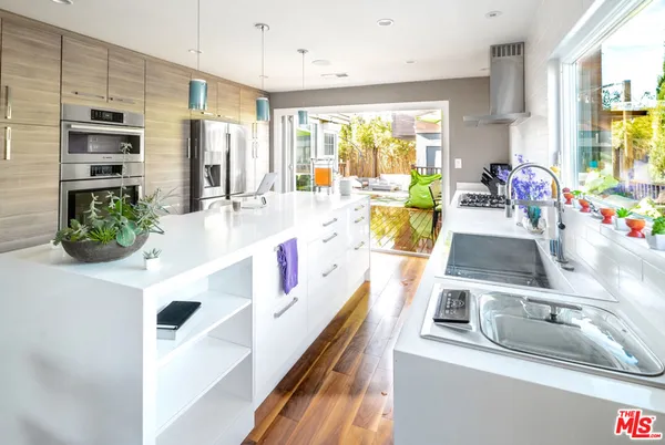 a view of kitchen with furniture and large window