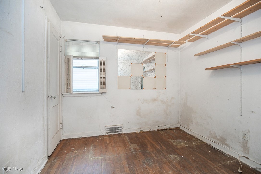 23901 Colbourne Road Euclid, OH 44123 - Photo 10 of 18 Empty room featuring dark wood-style floors