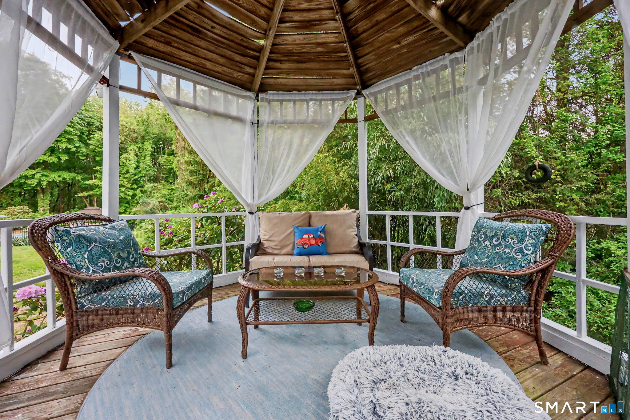 571 Wheeler Road Monroe, CT 06468 - Photo 34 of 40 a outdoor sitting area with furniture and wooden floor