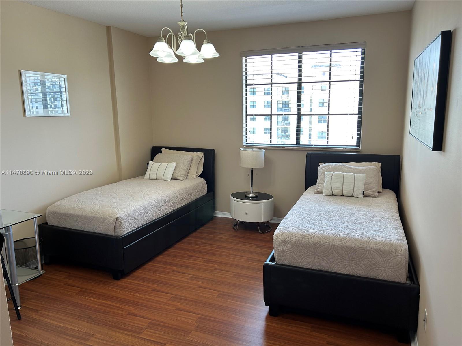 233 South Federal Highway, Unit 609 Boca Raton, FL 33432 - Photo 13 of 24 a bedroom with a bed and window