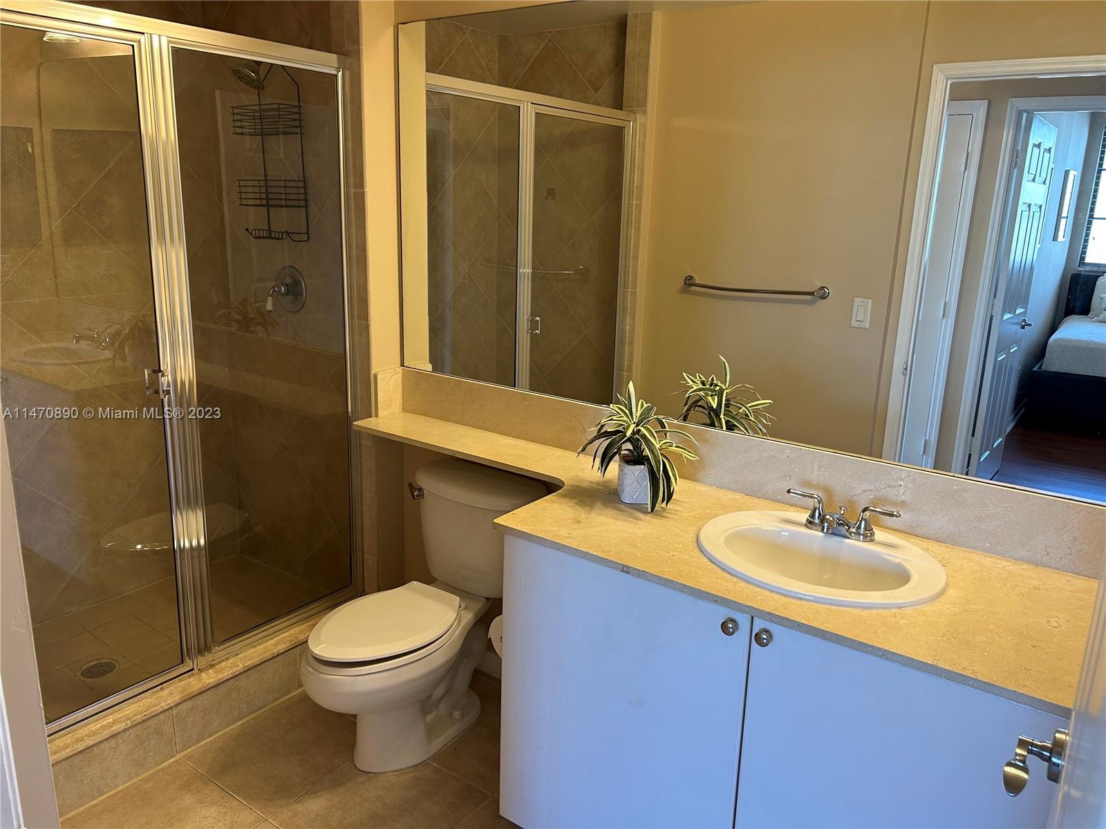233 South Federal Highway, Unit 609 Boca Raton, FL 33432 - Photo 16 of 24 a bathroom with a sink a toilet and shower