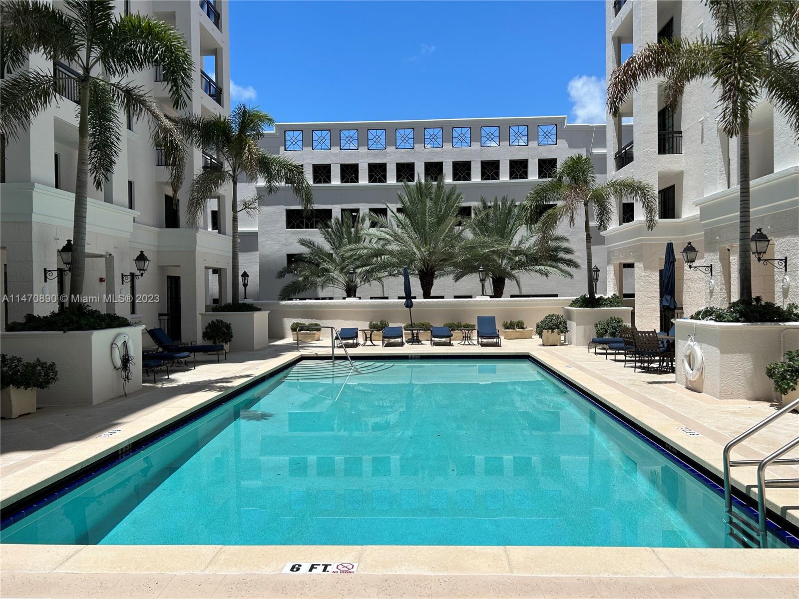 233 South Federal Highway, Unit 609 Boca Raton, FL 33432 - Photo 17 of 24 a view of a swimming pool with a patio