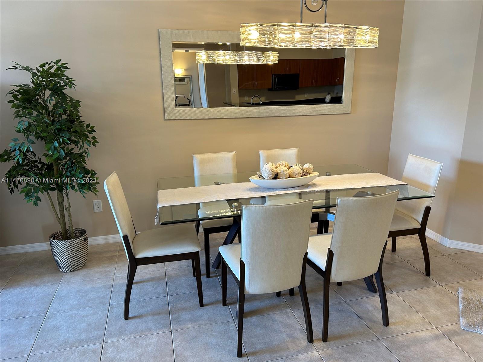 233 South Federal Highway, Unit 609 Boca Raton, FL 33432 - Photo 2 of 24 a dining room with furniture and chandelier
