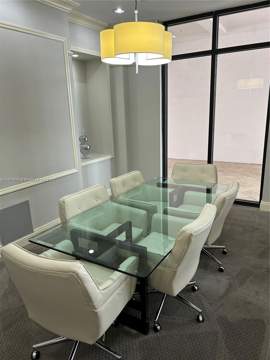 233 South Federal Highway, Unit 609 Boca Raton, FL 33432 - Photo 23 of 24 a dining room with furniture and a floor to ceiling window