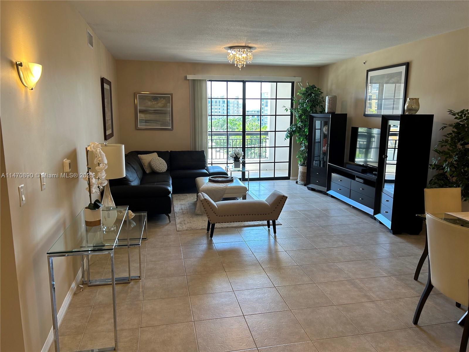 233 South Federal Highway, Unit 609 Boca Raton, FL 33432 - Photo 3 of 24 a living room with furniture and a window