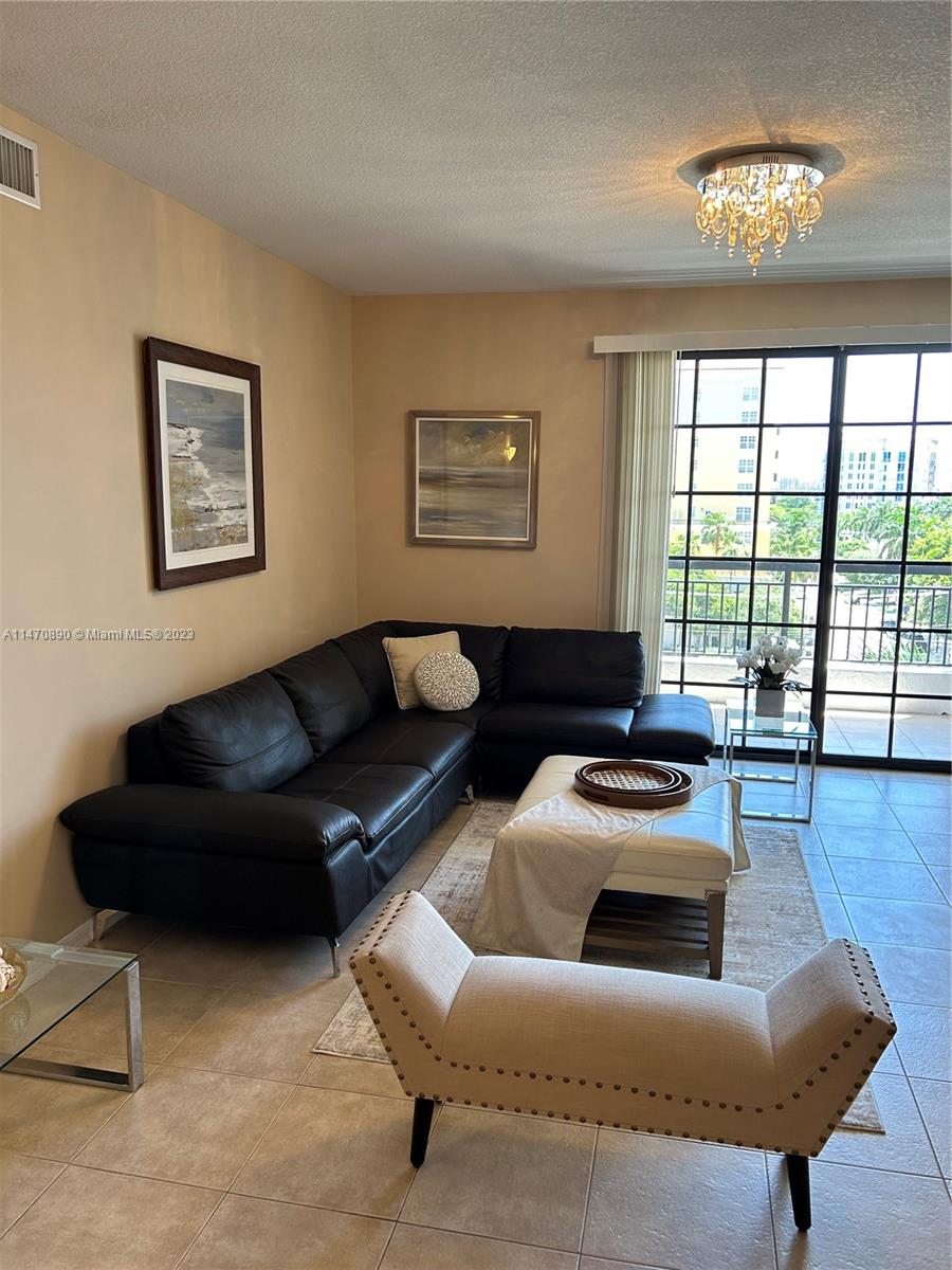 233 South Federal Highway, Unit 609 Boca Raton, FL 33432 - Photo 4 of 24 a living room with furniture and a large window