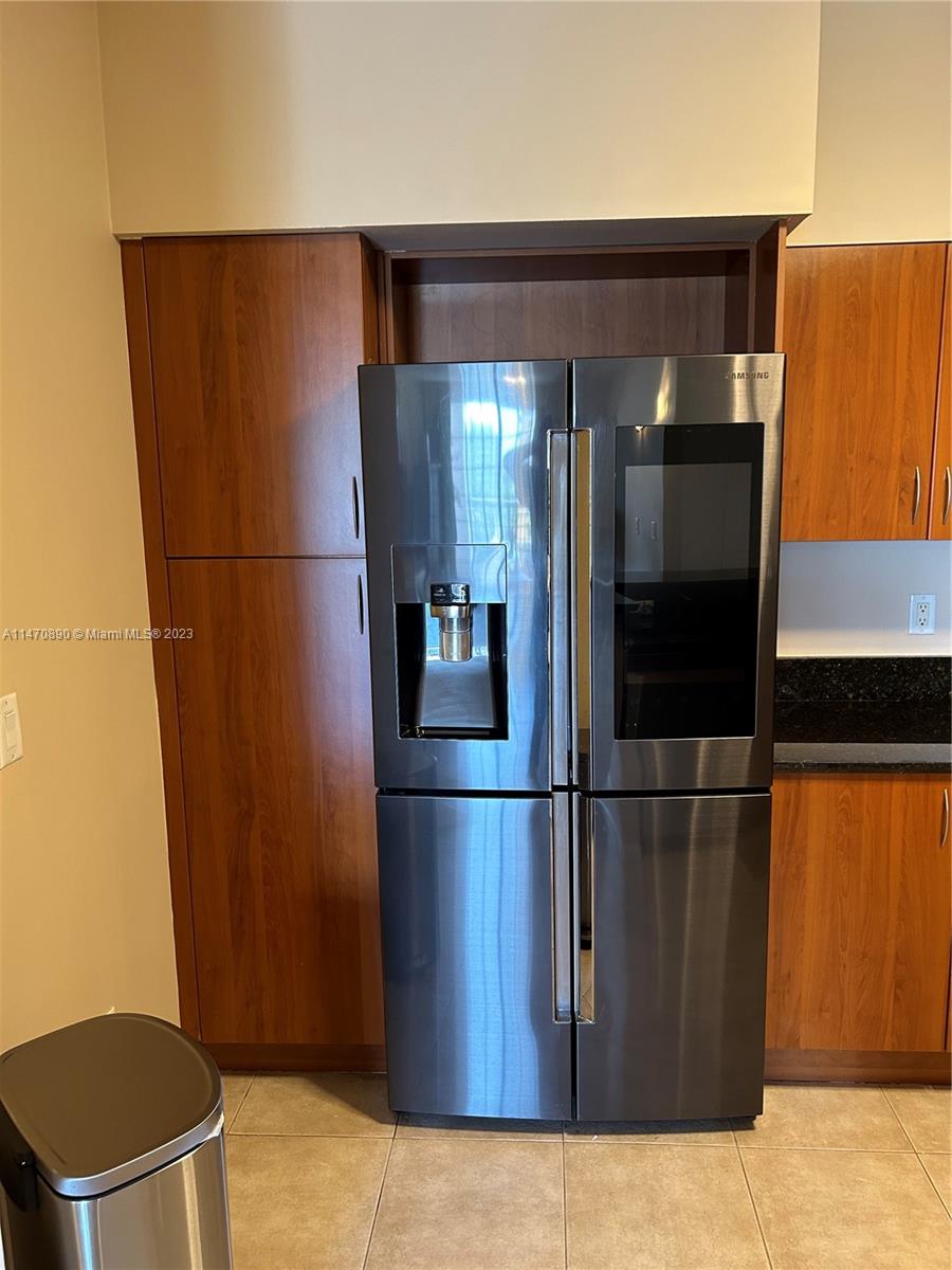 233 South Federal Highway, Unit 609 Boca Raton, FL 33432 - Photo 6 of 24 a refrigerator freezer sitting inside of a kitchen