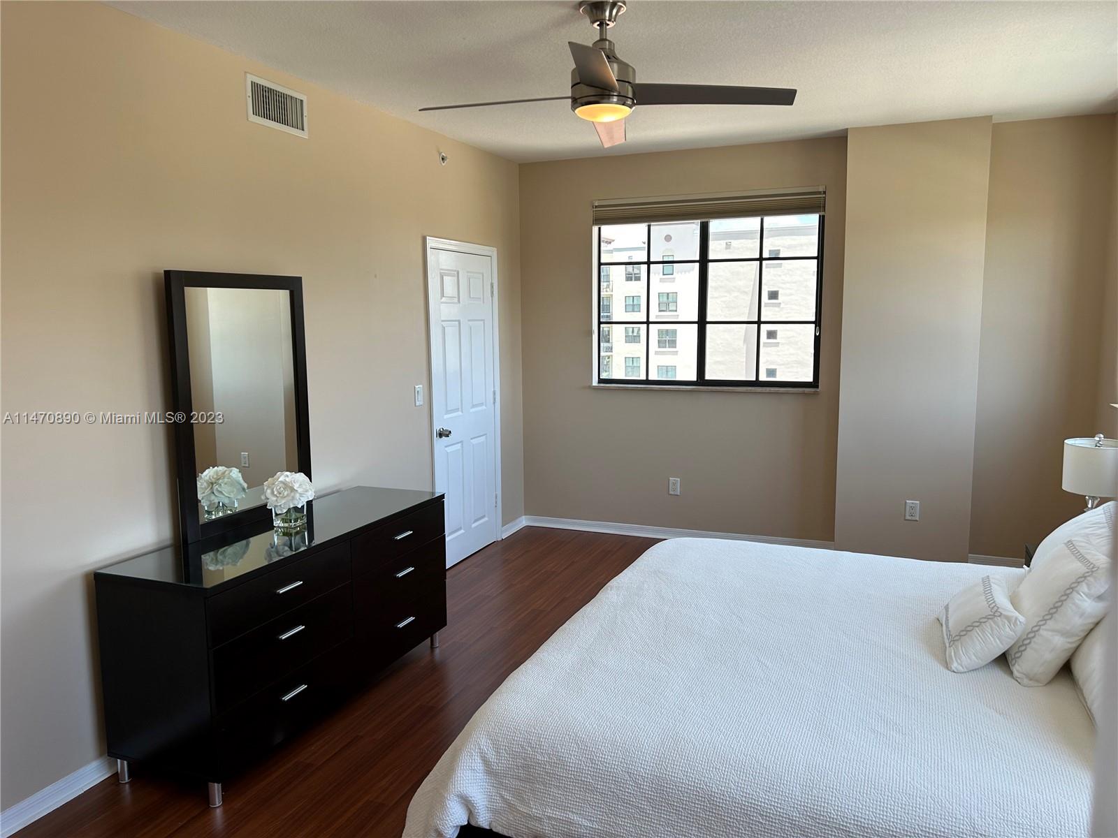233 South Federal Highway, Unit 609 Boca Raton, FL 33432 - Photo 10 of 24 a bedroom with a bed and a dresser