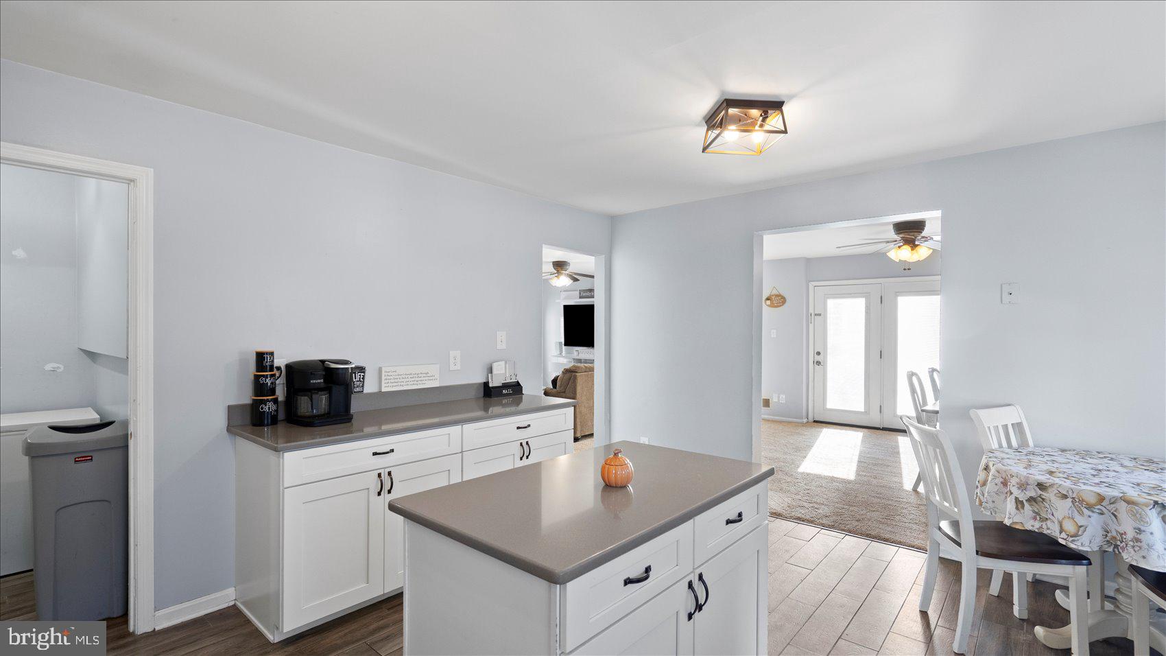 9905 Magledt Road Baltimore, MD 21234 - Photo 16 of 45 a kitchen with granite countertop a sink a counter space and appliances