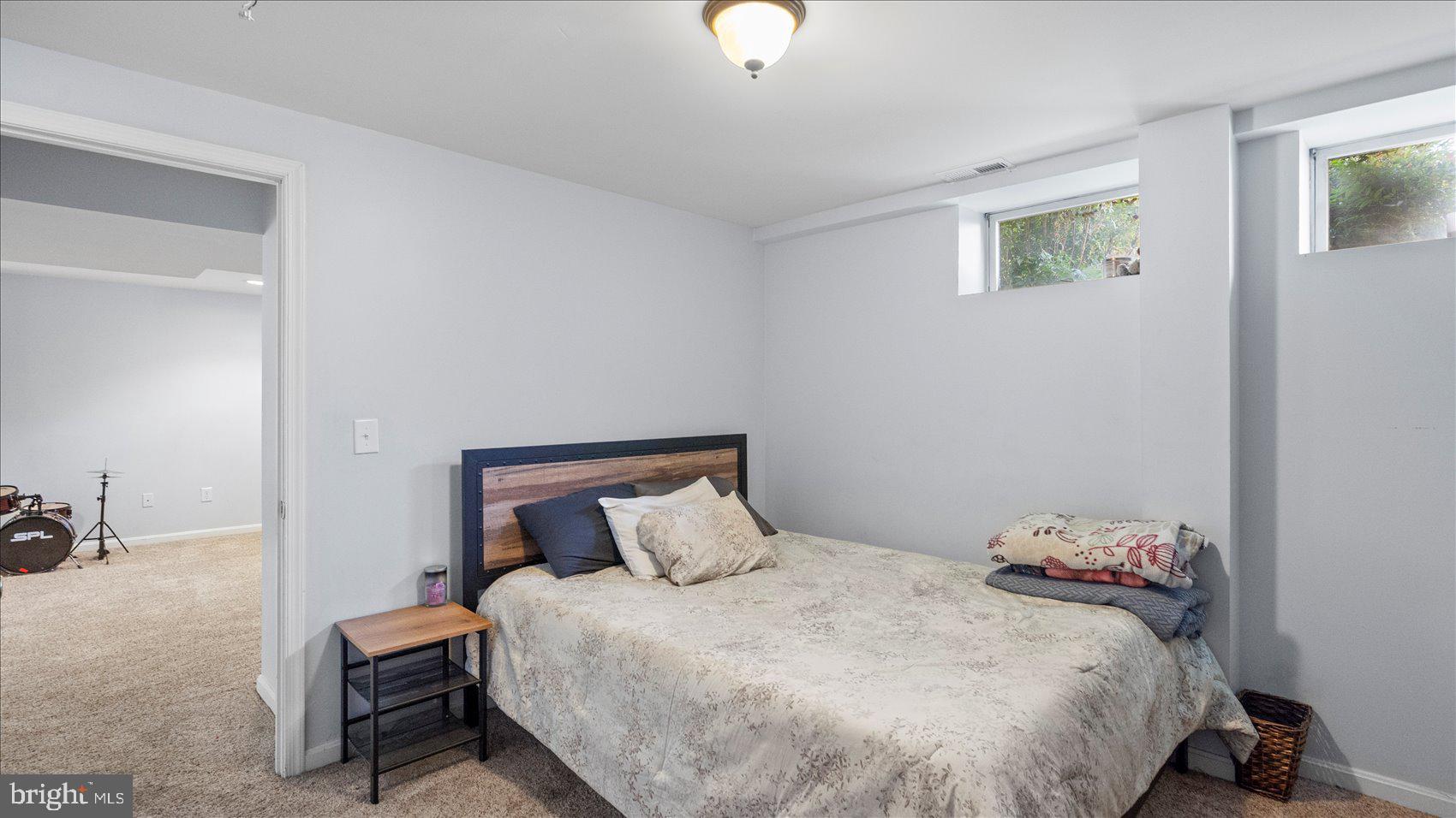 9905 Magledt Road Baltimore, MD 21234 - Photo 20 of 45 a bedroom with a bed and painting on the wall