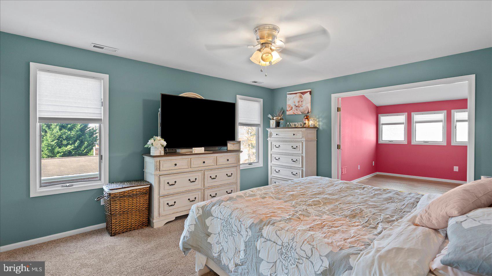 9905 Magledt Road Baltimore, MD 21234 - Photo 22 of 45 a bedroom with a bed and a flat screen tv on dresser