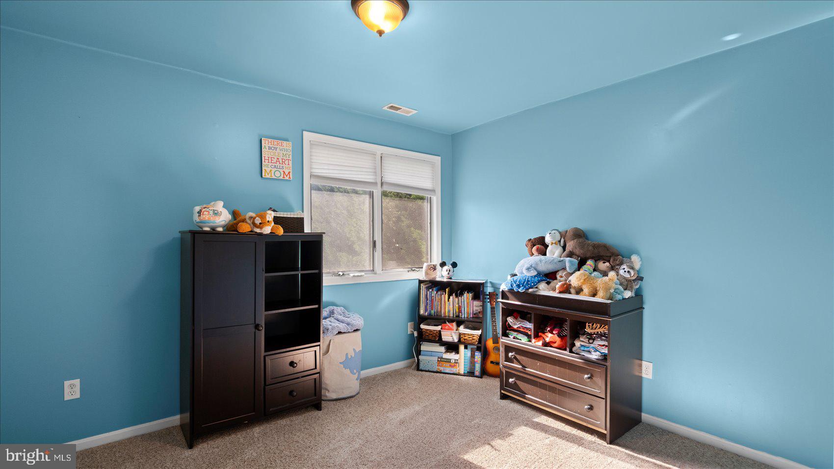 9905 Magledt Road Baltimore, MD 21234 - Photo 26 of 45 a room with furniture and a book shelf