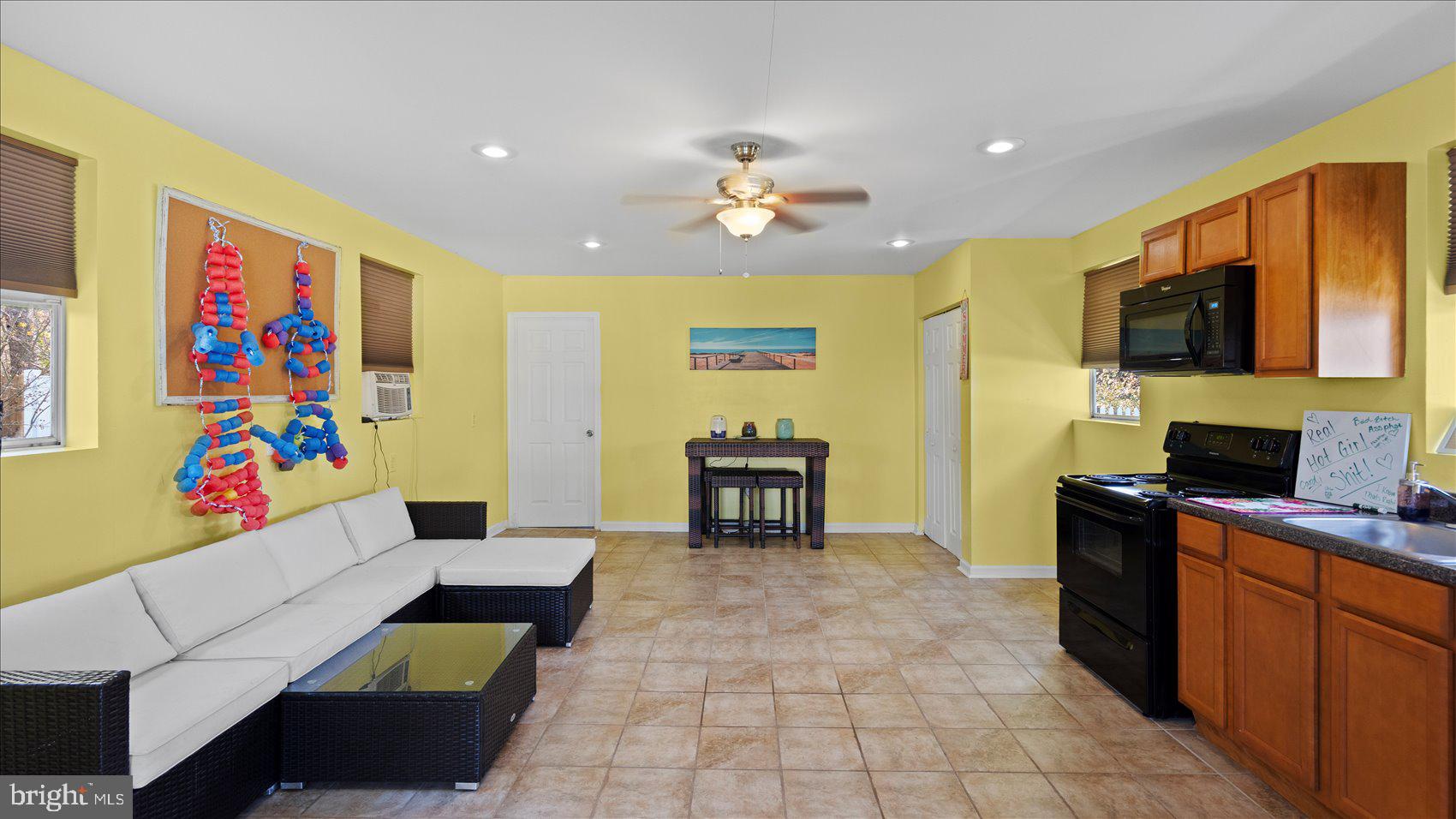 9905 Magledt Road Baltimore, MD 21234 - Photo 34 of 45 a living room with furniture and a flat screen tv