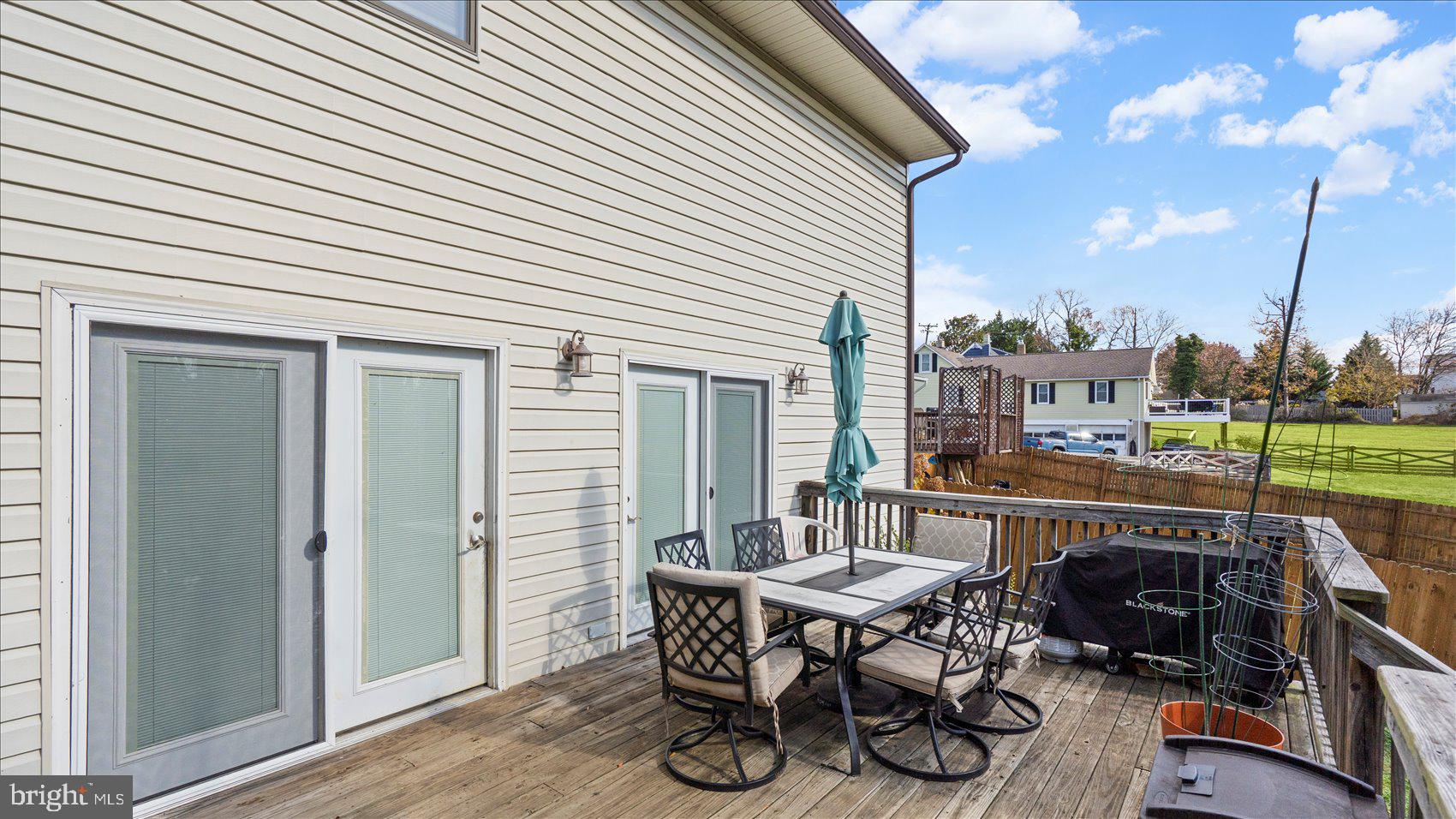 9905 Magledt Road Baltimore, MD 21234 - Photo 41 of 45 a patio with table and chairs and potted plants