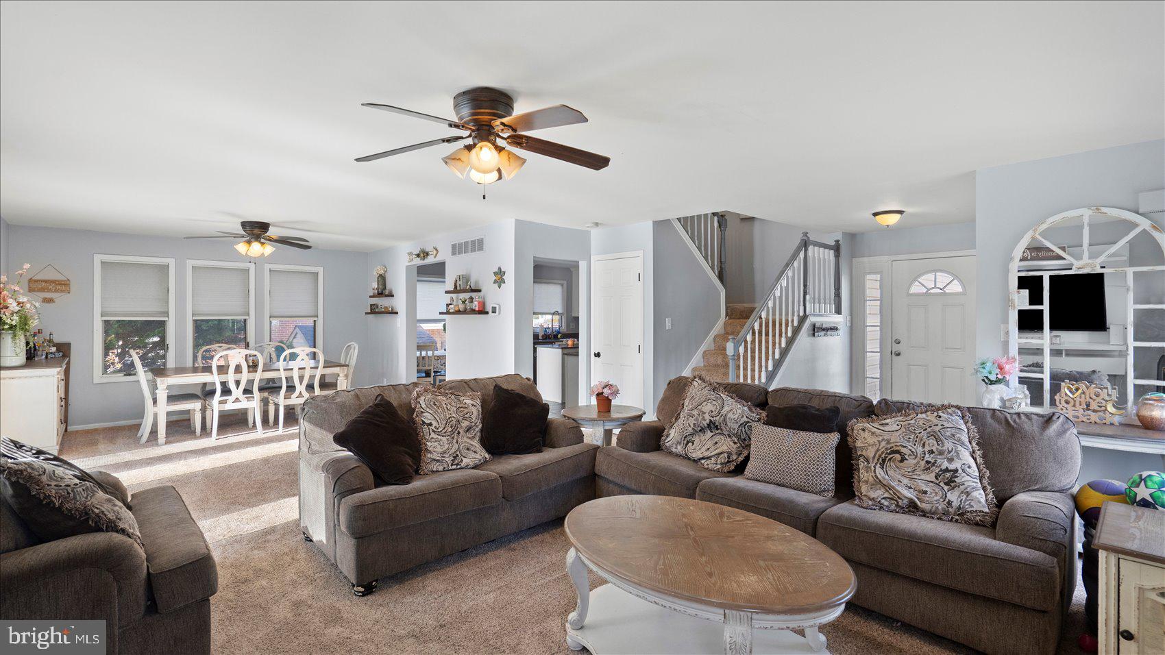 9905 Magledt Road Baltimore, MD 21234 - Photo 7 of 45 a living room with furniture kitchen view and a chandelier