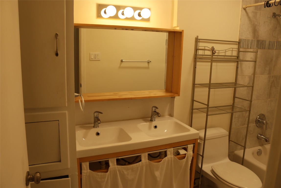 2713 St Edwards Circle, Unit A Austin, TX 78704 - Photo 8 of 11 Bathroom with shower / tub combination and double vanity