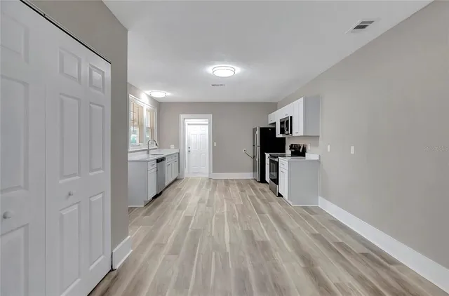 a view of a kitchen from the hallway