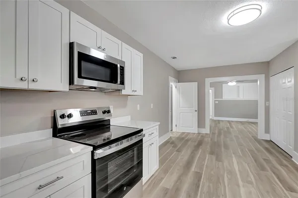 a kitchen with a stove and a microwave