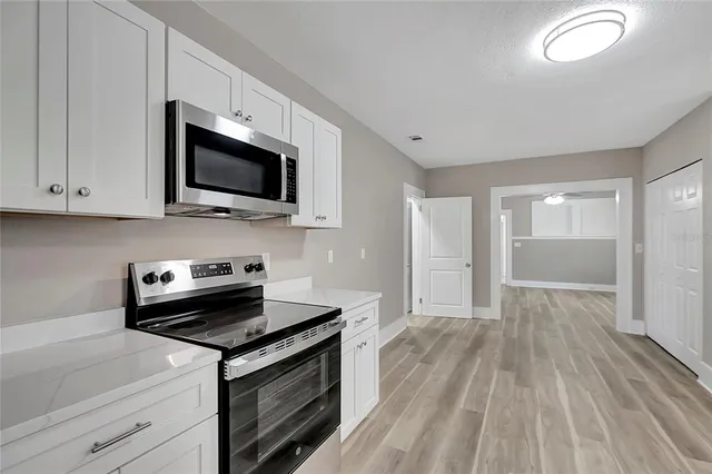 a kitchen with a stove and a microwave