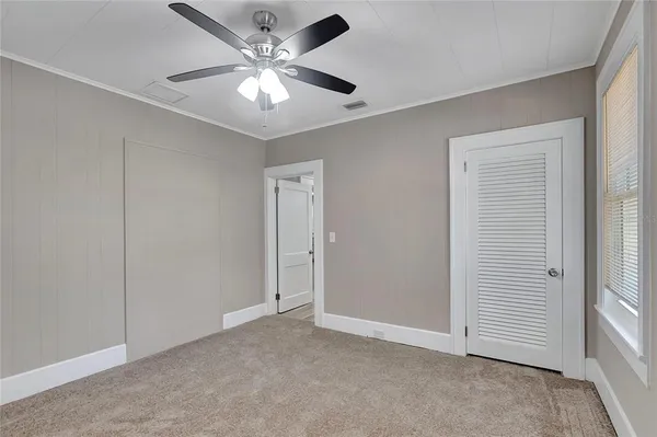 a view of a livingroom with a ceiling fan