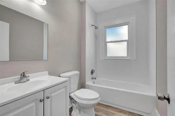 a bathroom with a sink toilet and a bathtub