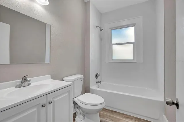 a bathroom with a sink toilet and a bathtub