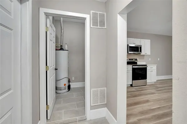 a view of a kitchen from the hallway
