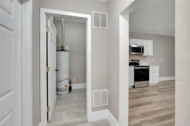a view of a kitchen from the hallway