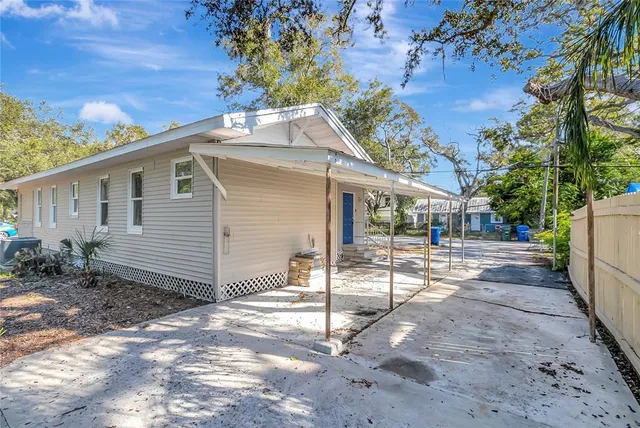 a view of a porch with wooden floor and fence
