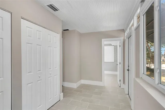 a view of a hallway with closet area