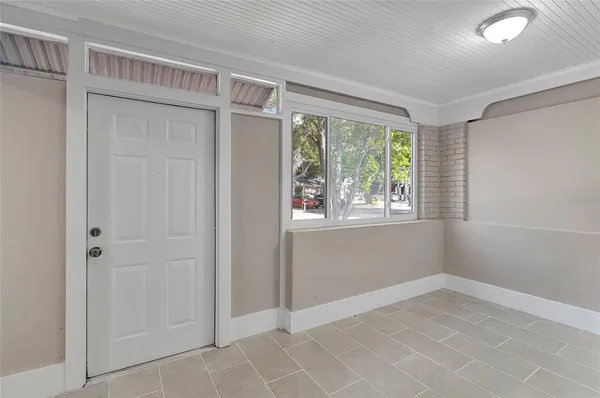 a view of an empty room with a window