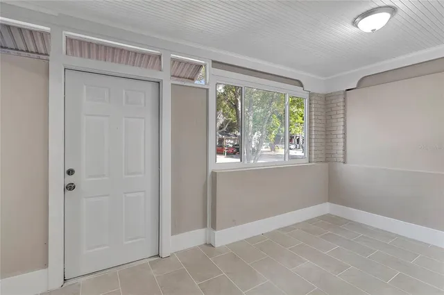 a view of an empty room with a window