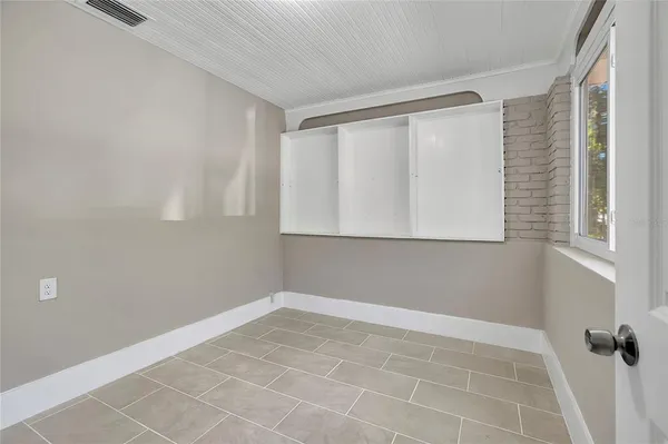 a view of an empty room with a window