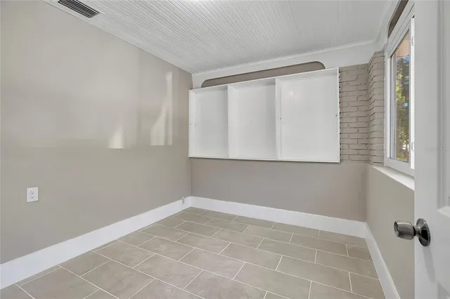 a view of an empty room with a window