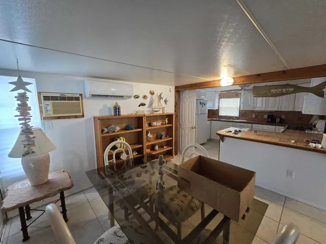 a view of a kitchen and dining room