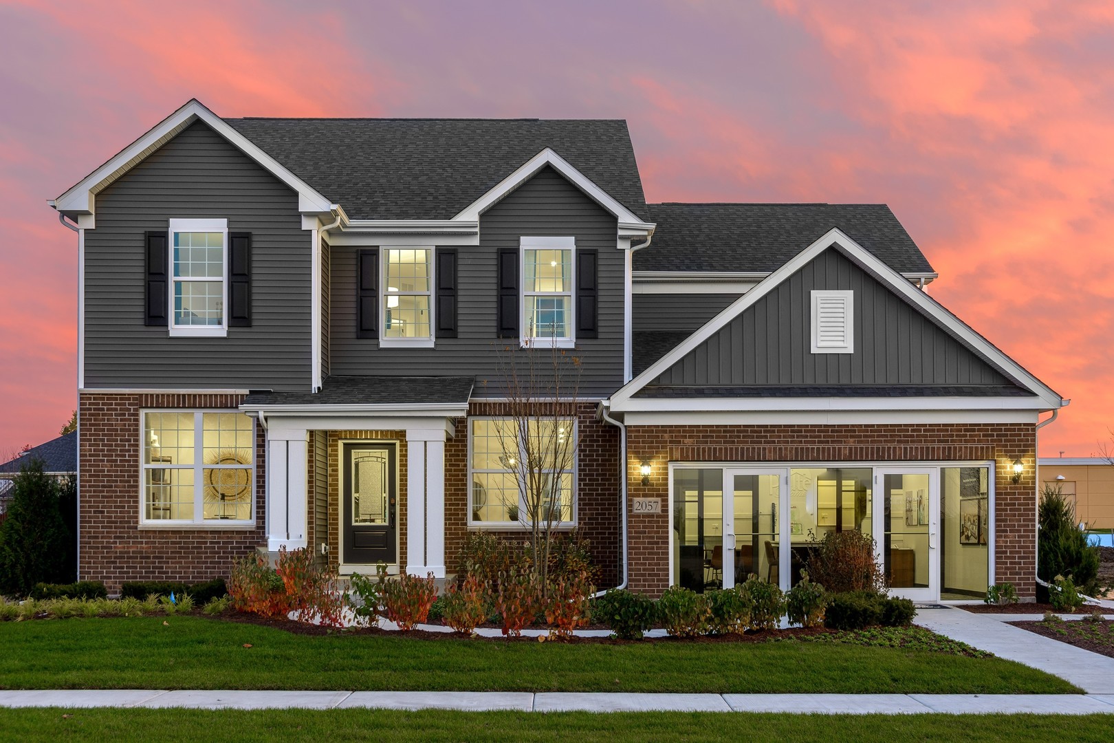 a front view of a house with a yard