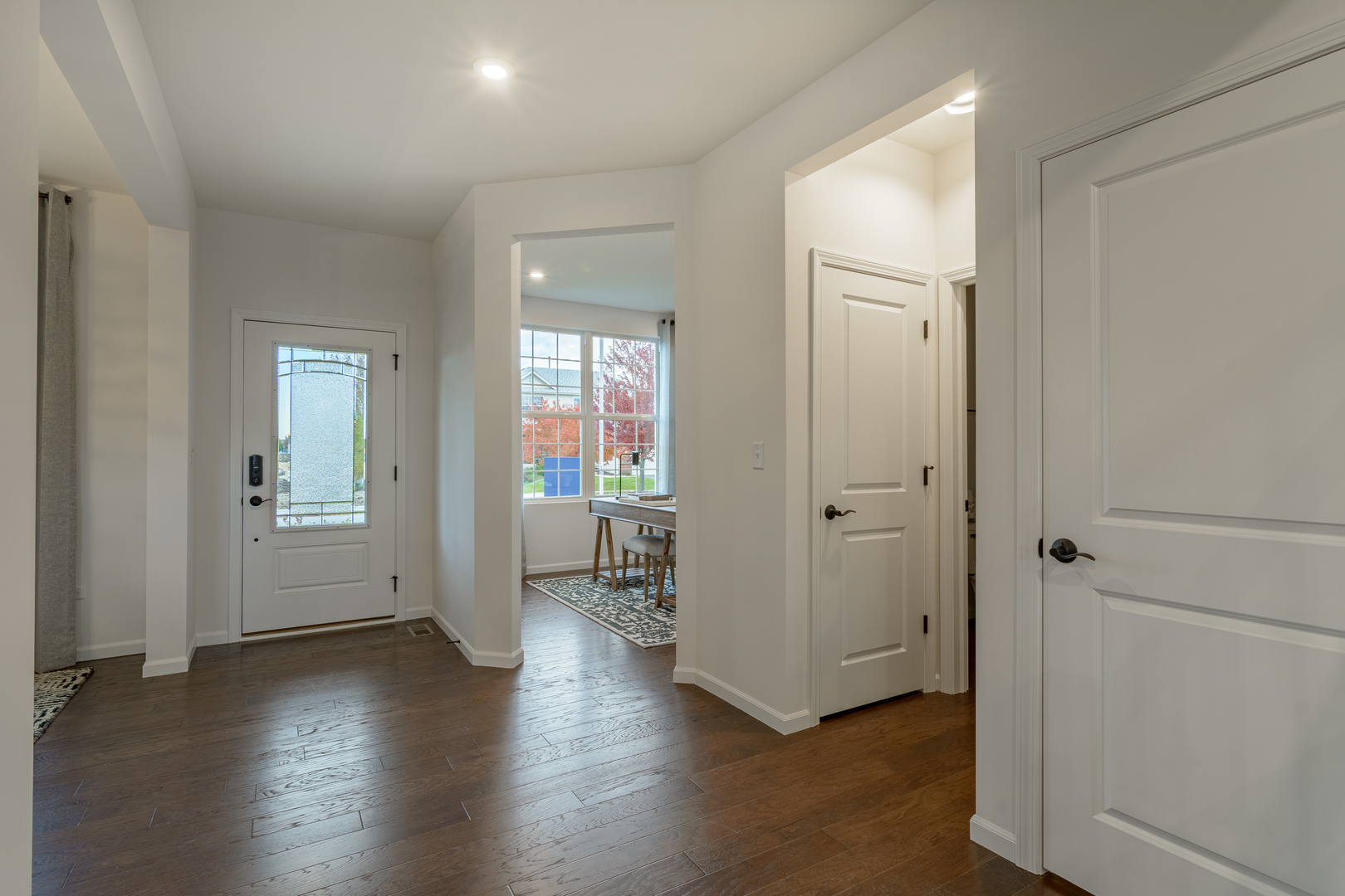 1270 Driscoll Lane Addison, IL 60101 - Photo 2 of 25 an empty room with wooden floor and a bathroom