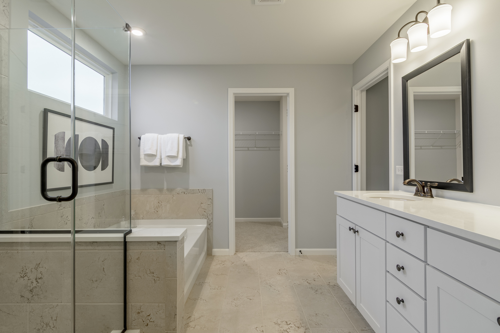 1270 Driscoll Lane Addison, IL 60101 - Photo 23 of 25 a bathroom with a double vanity sink and mirror