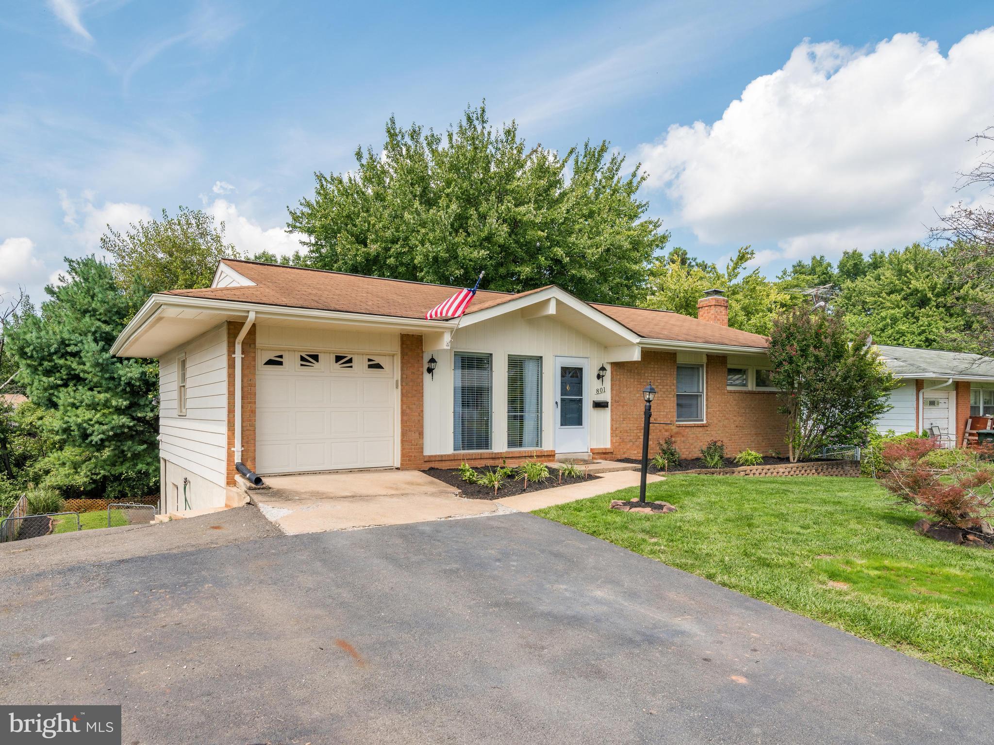 Front w/ 1 Car Garage & Large Driveway