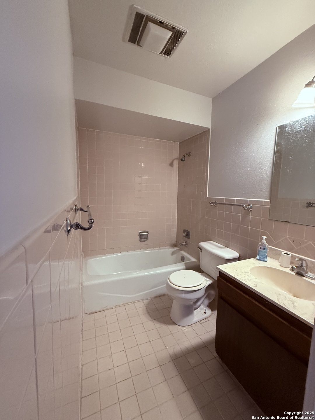 923 Vance Jackson Road, Unit 804 San Antonio, TX 78201 - Photo 5 of 10 a bathroom with a sink a toilet and shower